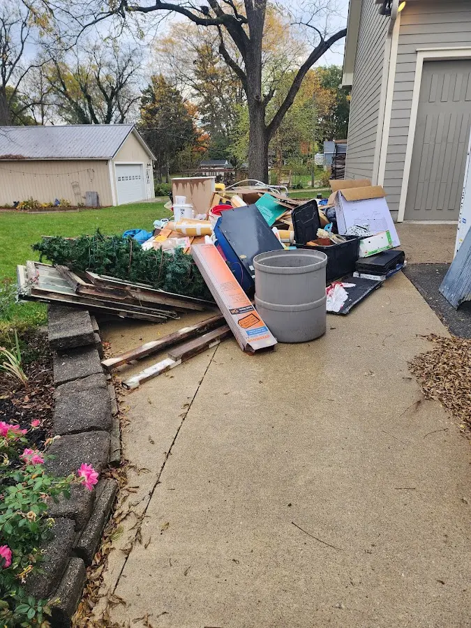 Dumpster being loaded with debris for 12 Yard Dumpster Rental in Santa Venetia